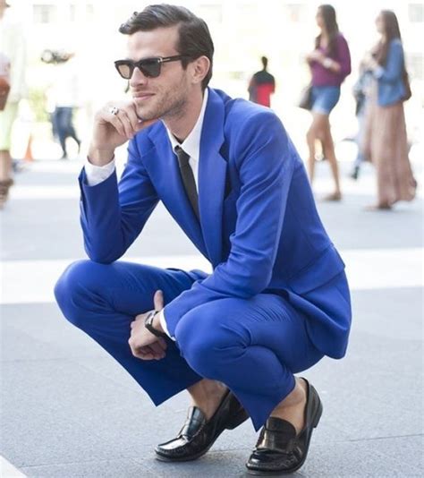 blue suit and black shoes